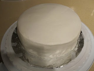 Cake with plain white frosting.