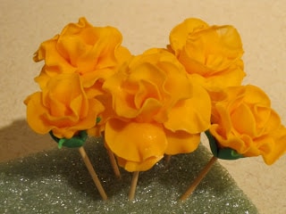 Close up of orange fondant roses.
