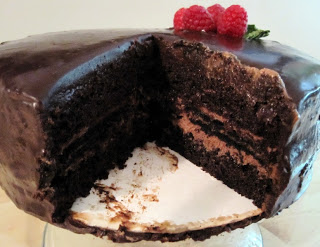 Chocolate cake on a cake plate.