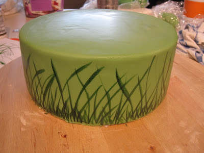 Panting grass on the side of the cake.
