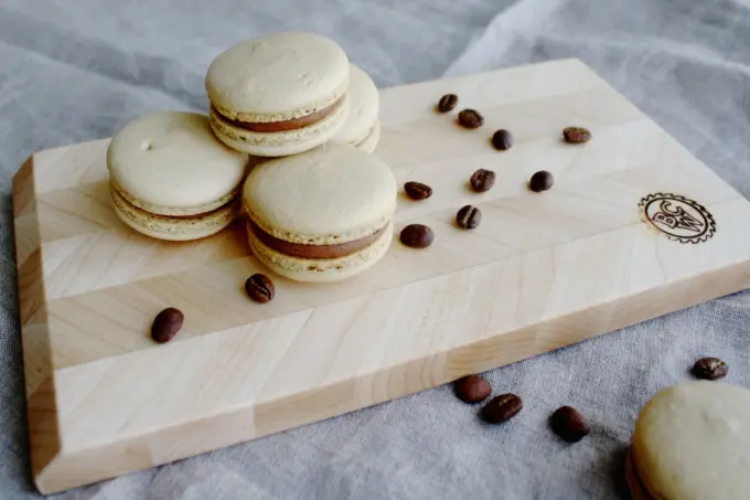 Macarons on a cutting board.