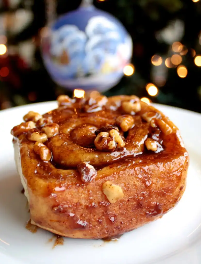 Roll on a white plate with a holiday ornament in the background.