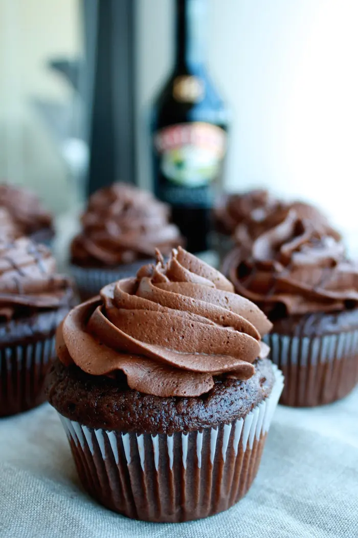 Chocolate cupcakes on a table.