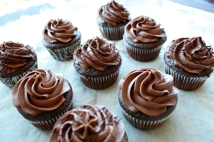 Chocolate cupcakes on a table.