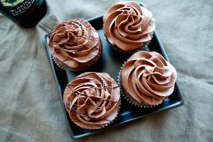 Angled shot of cupcakes on a plate.