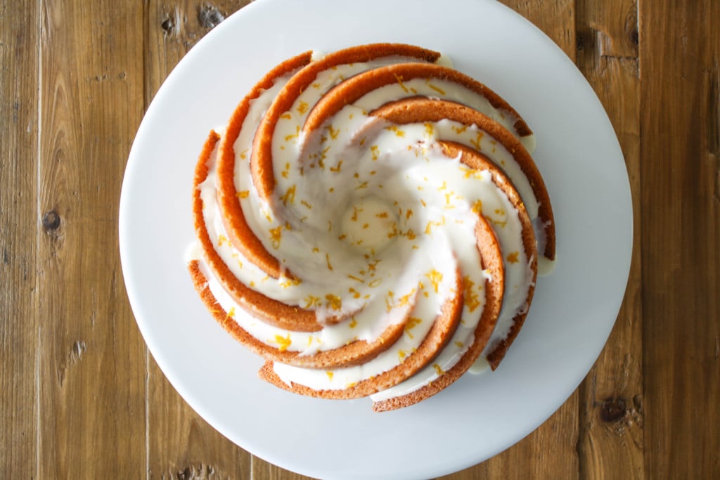 Overhead picture of a spiral lemon bundt cake with glaze.