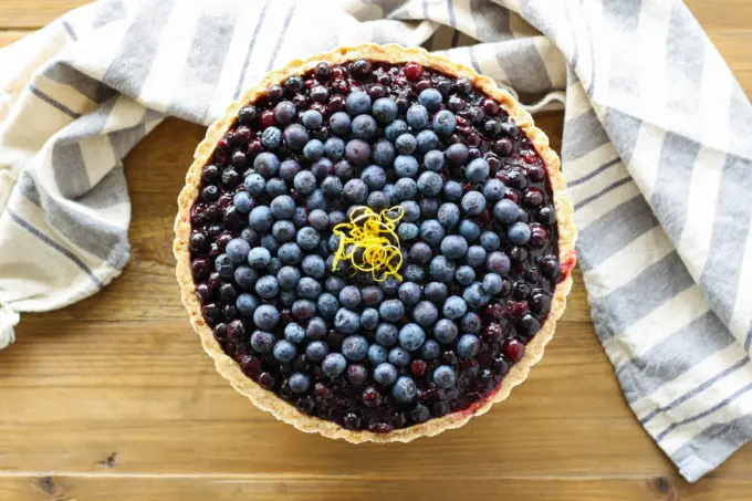 Overhead shot of the tart on a wooden table.