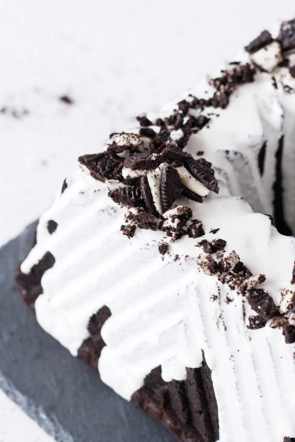 Close up of the Oreo cookies chopped on top of the cake
