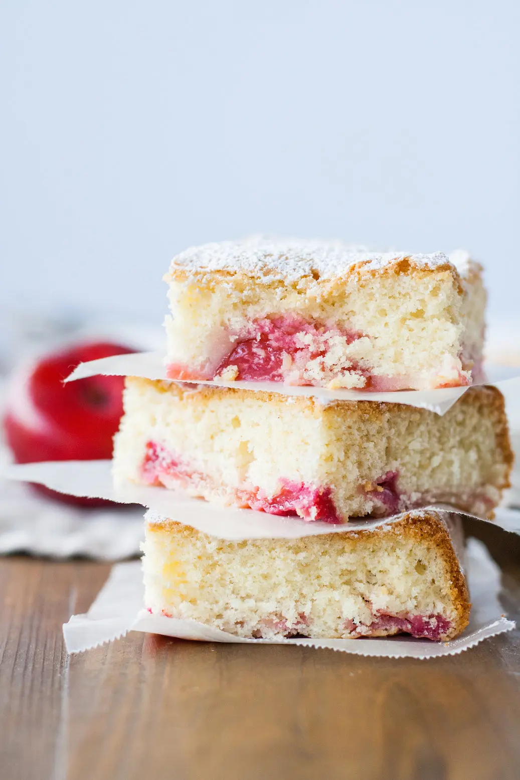 Squares of cake stacked on each other.