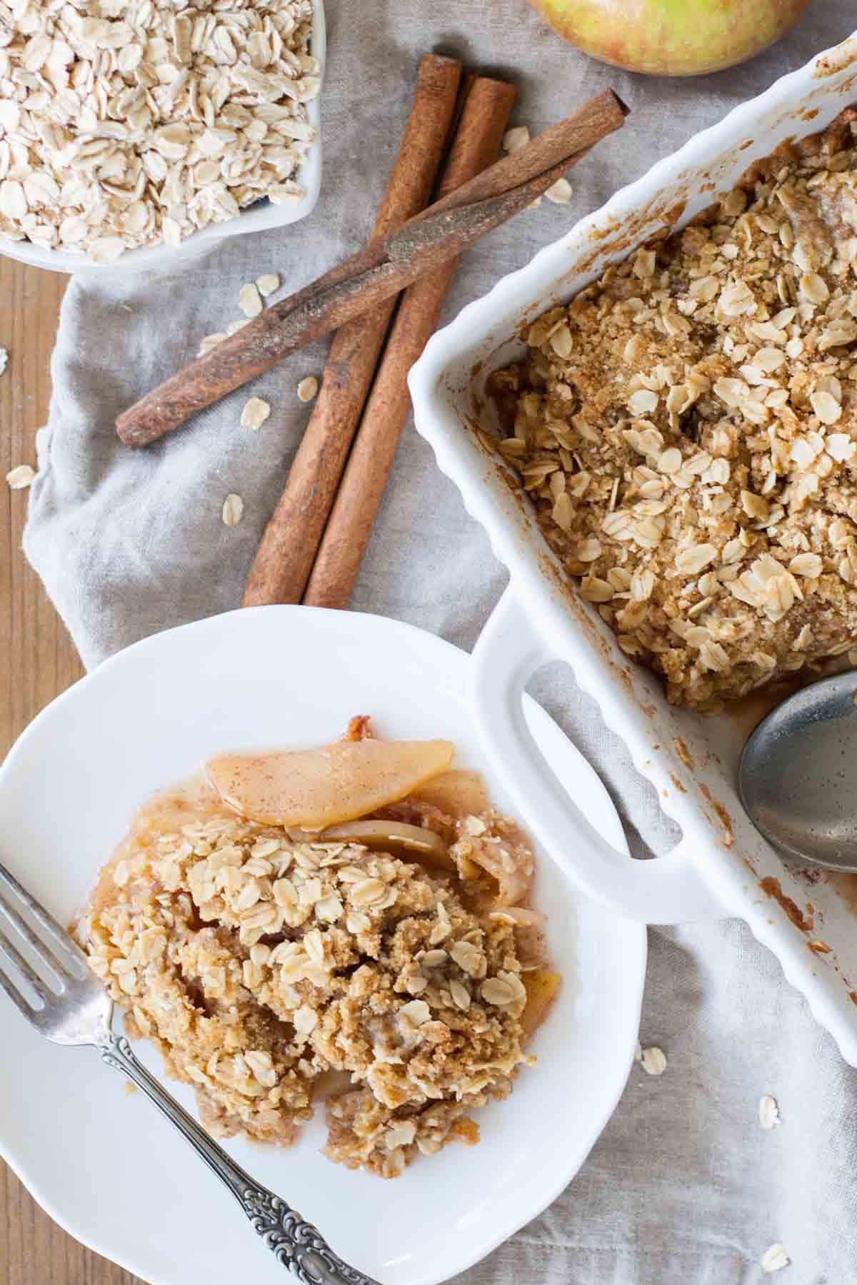 Apple crisp spooned onto a plate.