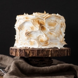 Cake on a rustic wood cake stand.
