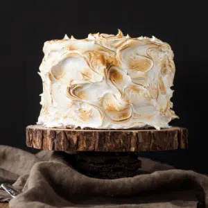 Cake on a rustic wood cake stand.