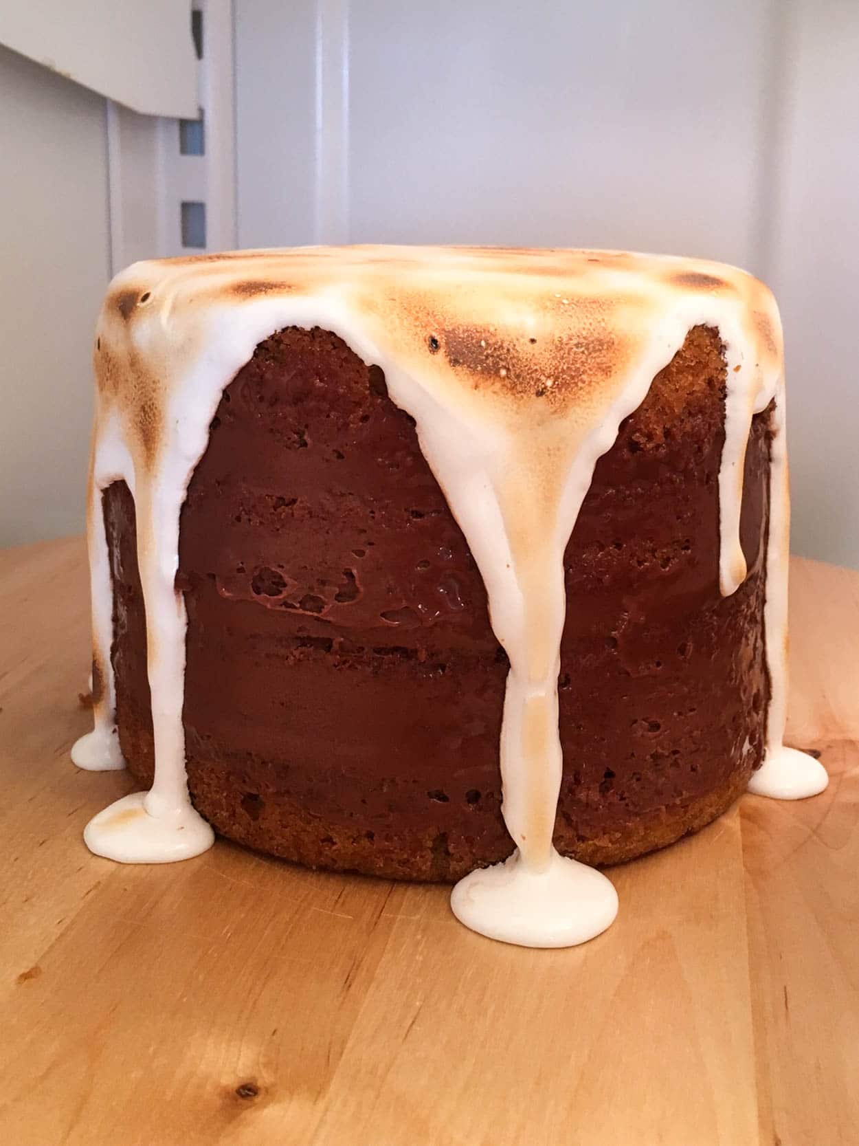 Cake with marshmallow drip in the fridge.