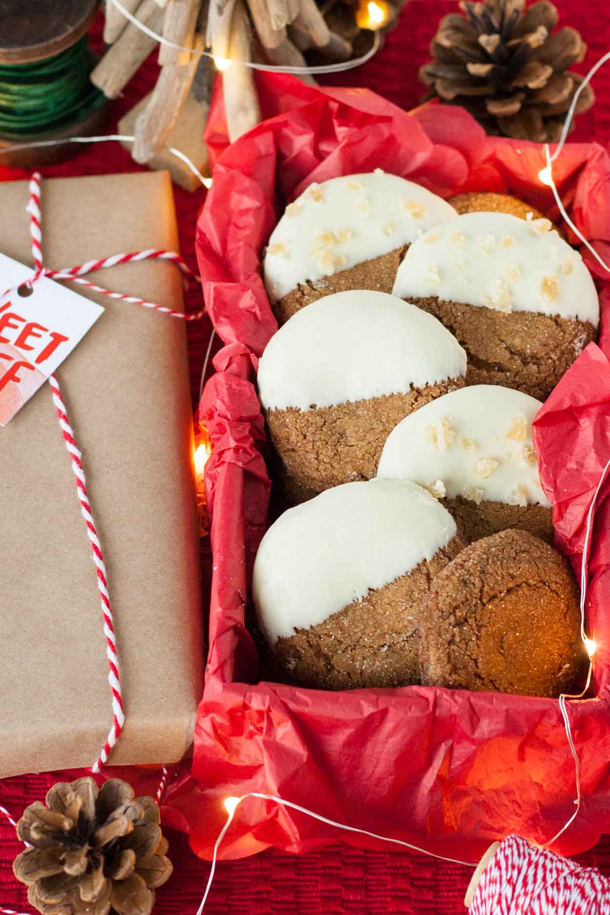 A box of white chocolate dipped chewy gingerbread cookies