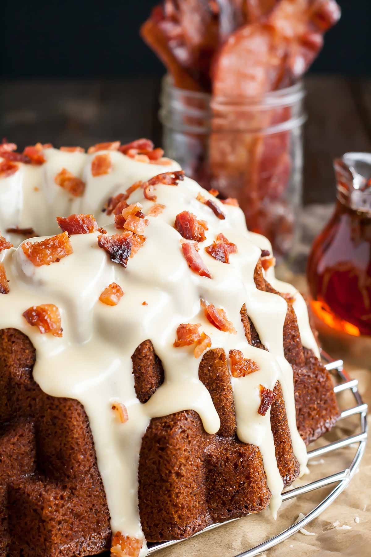 Close up of the maple glaze and chopped bacon on top of the cake.