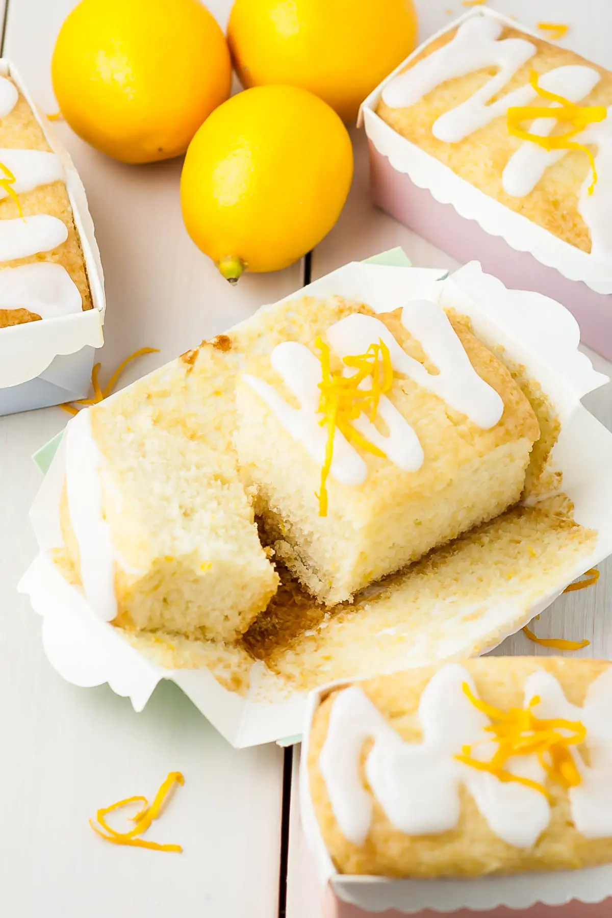 Lemon loaf with a slice cut from it.