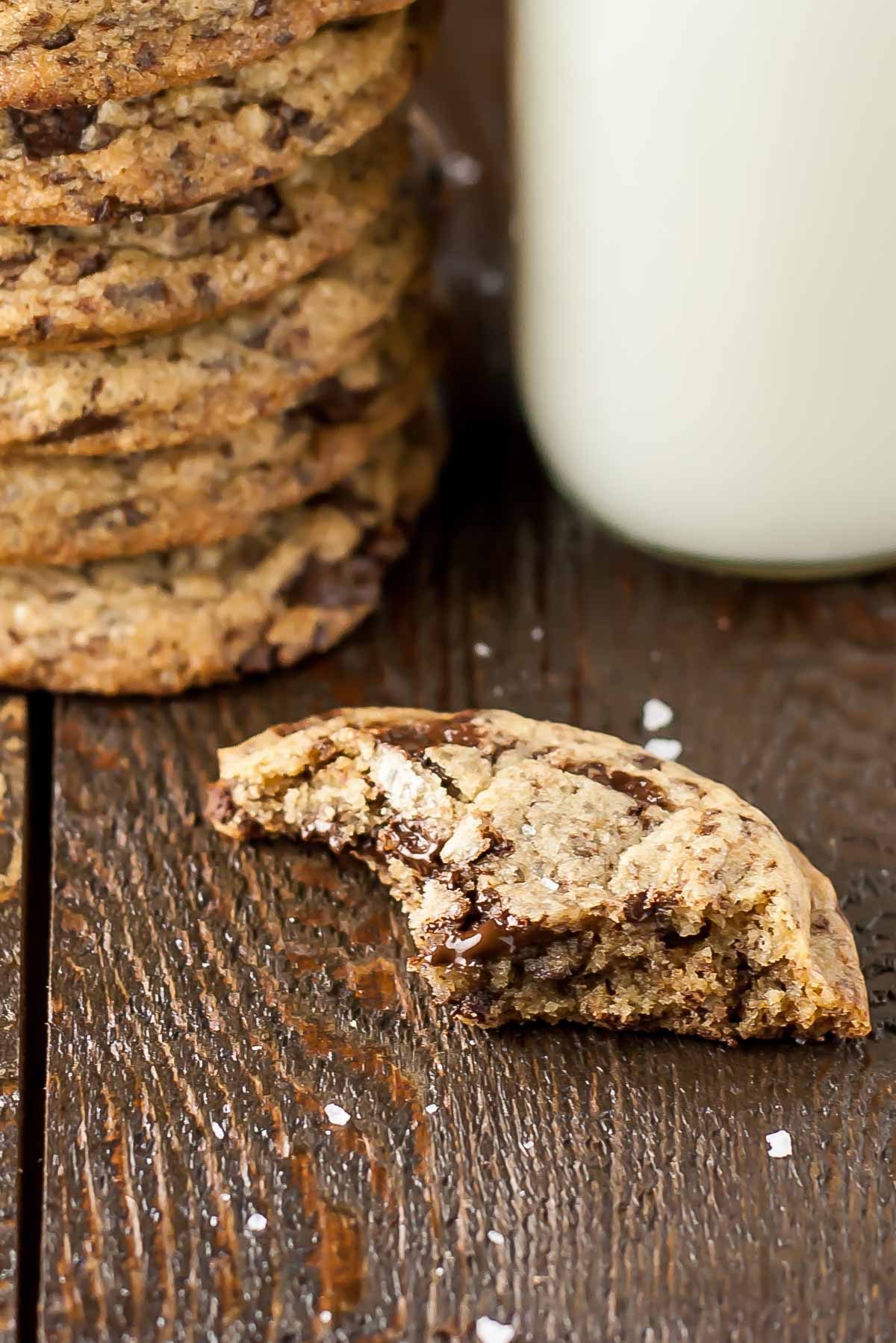 A small piece of cookie left after bites taken out of it.