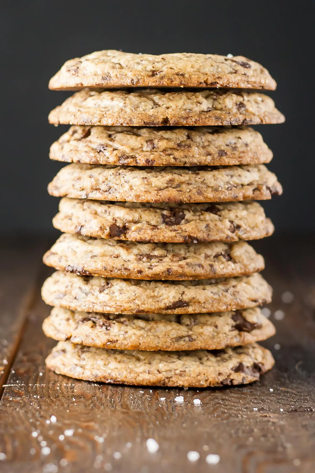 A stack of cookies on a wooden table.