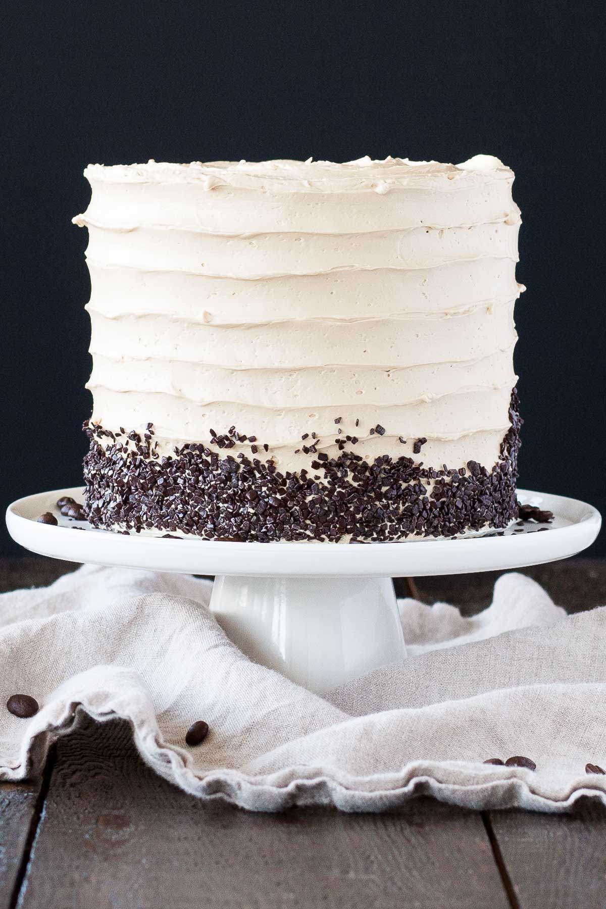 Cake on a white cake stand.