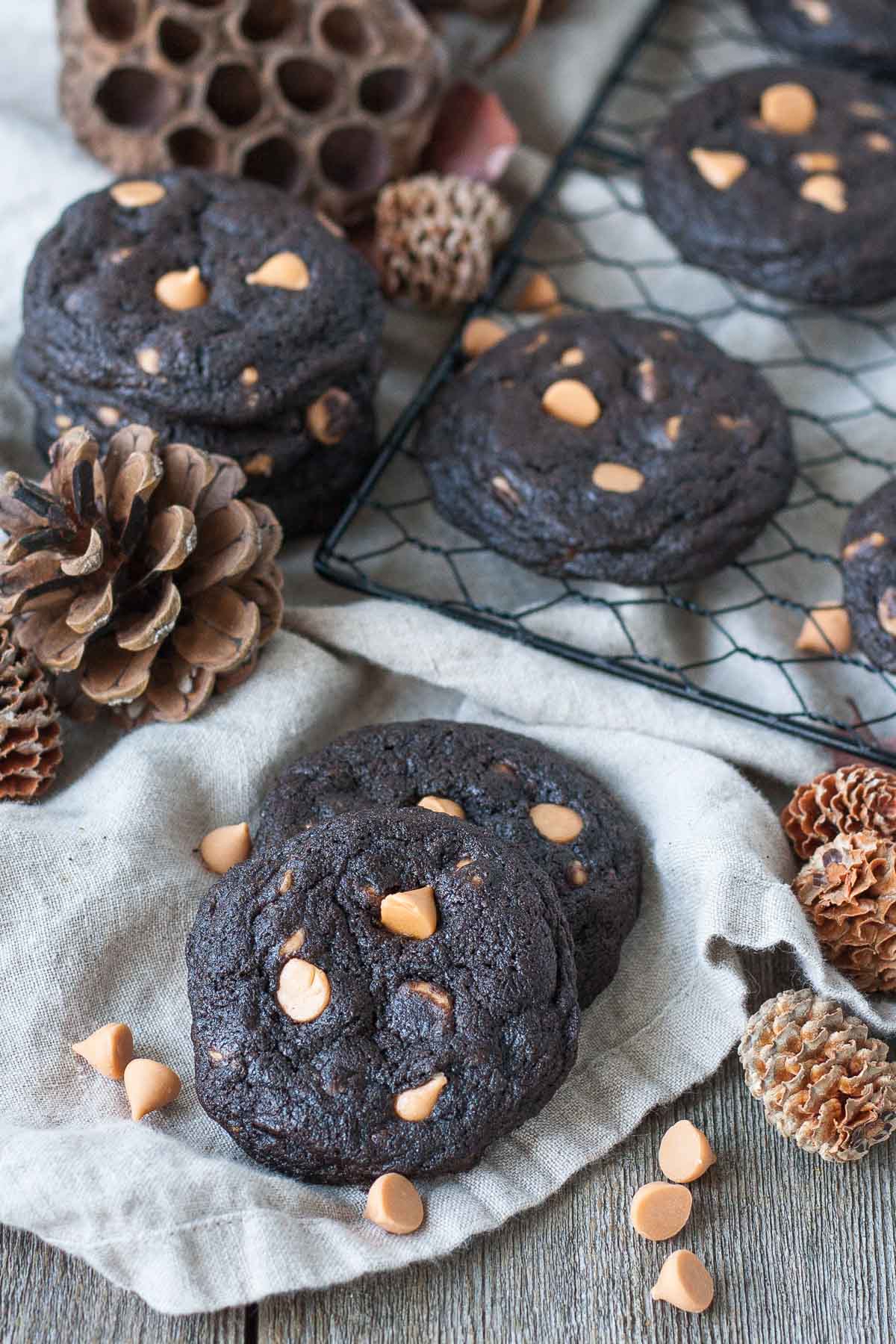 Cookies on a wooden table with fall decor.