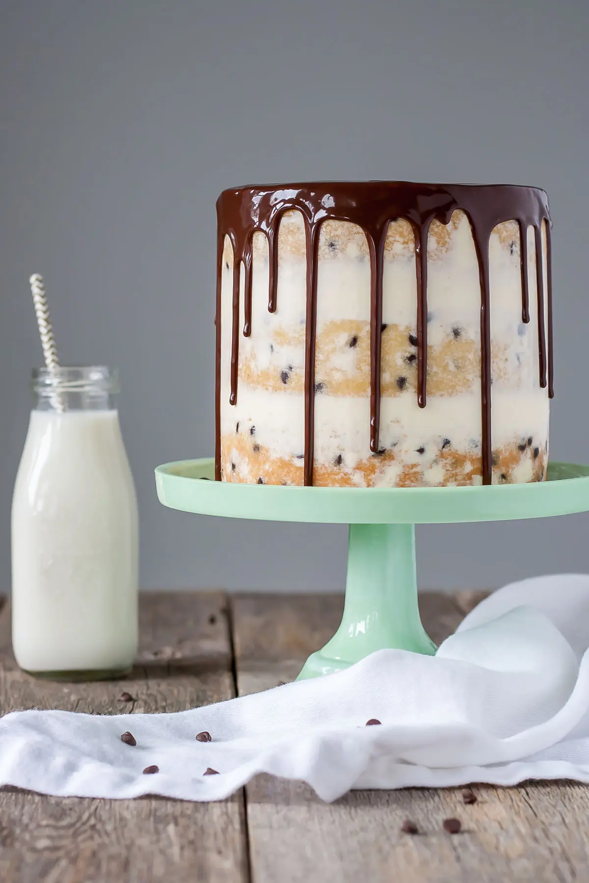 Chocolate chip naked cake with a vanilla buttercream and ganache drip.