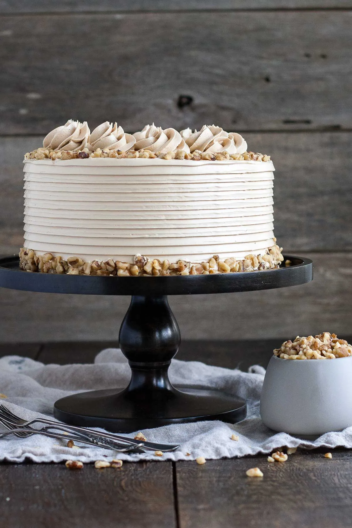 Cake on a dark cake stand.