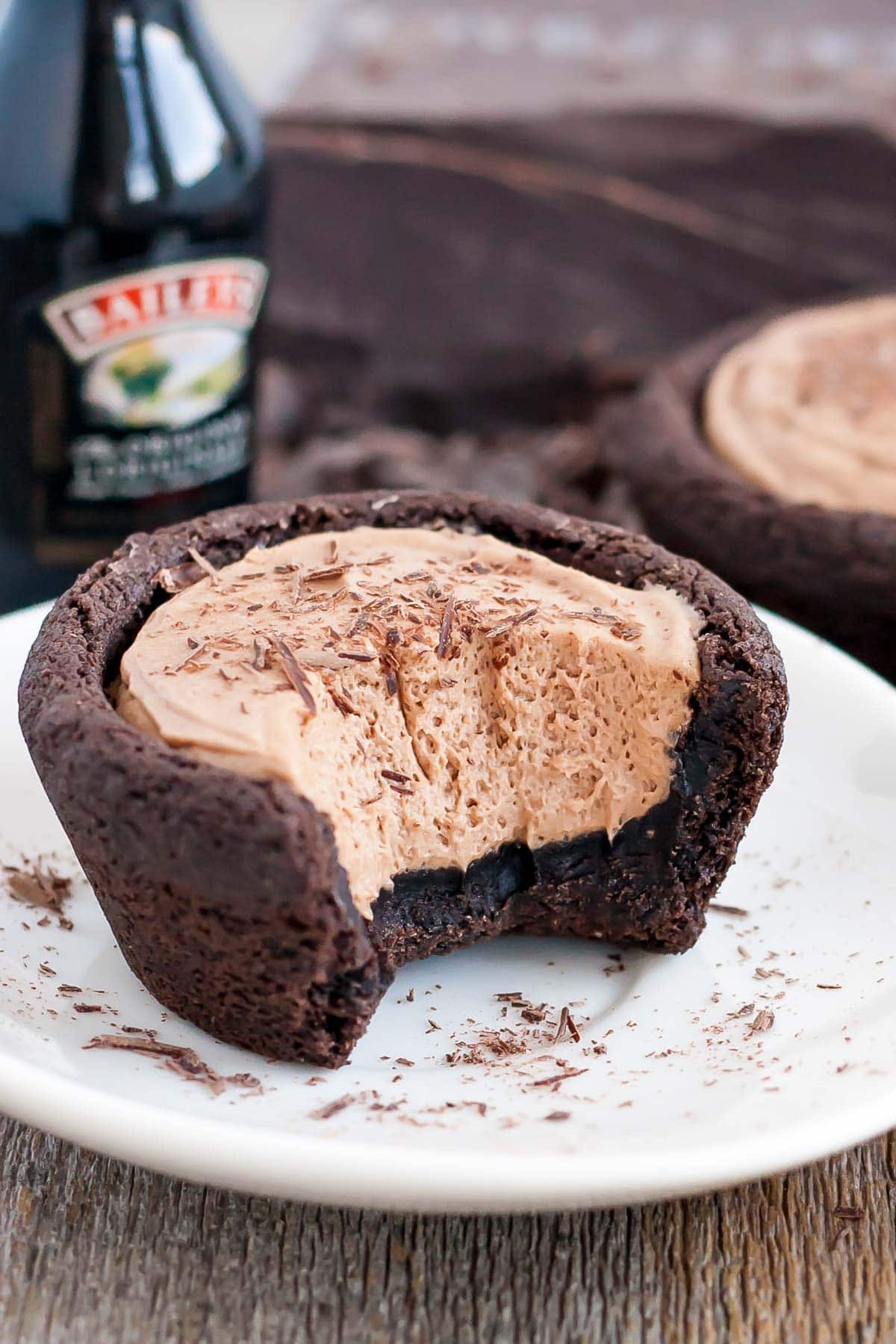 Baileys cheesecake cookie cup with a bit taken out of it.