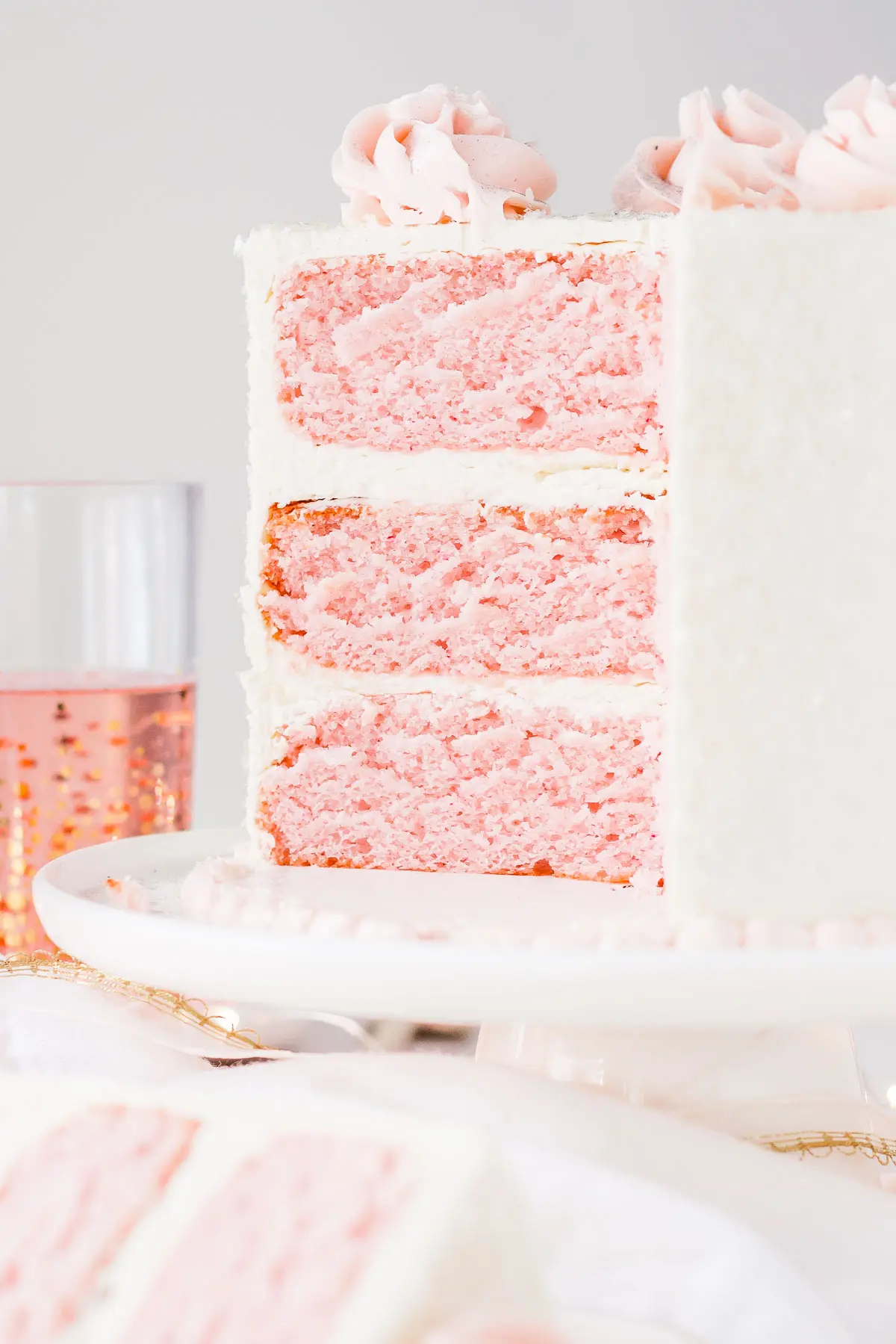 Cross section of pink champagne cake with vanilla buttercream.