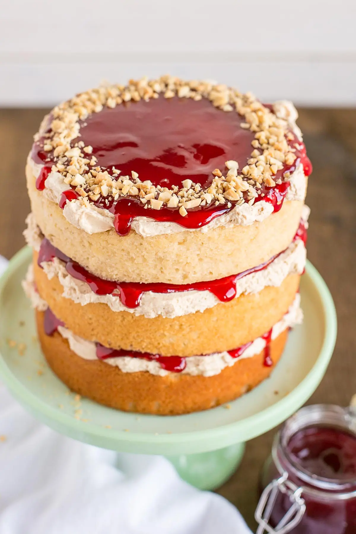 The top of the cake with the raspberry jelly dripping down.