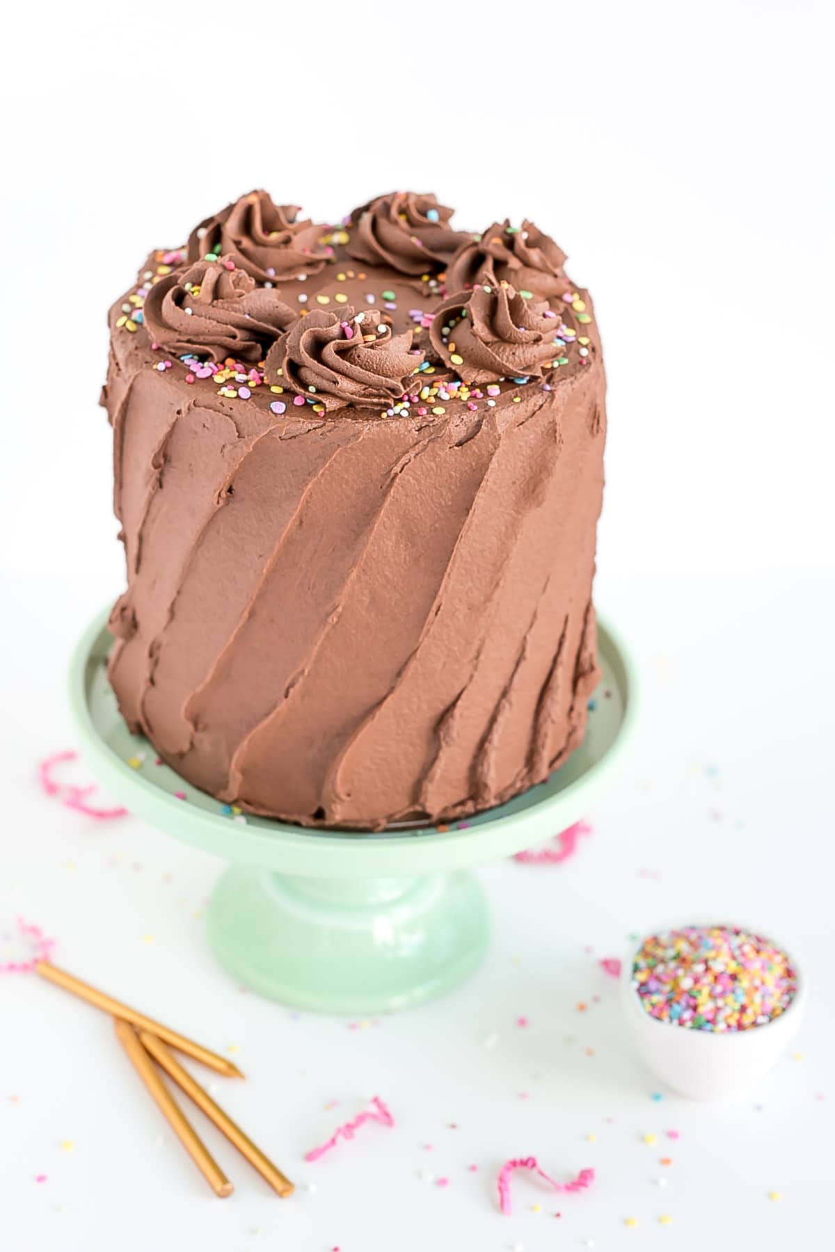 Cake with chocolate frosting and sprinkles.