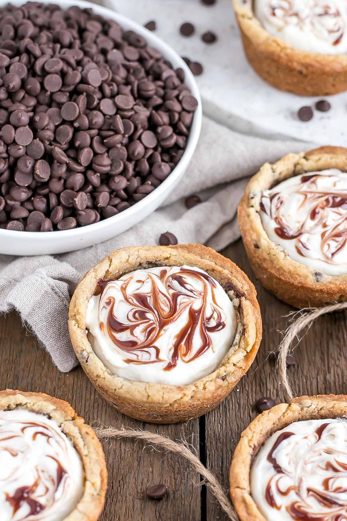 A wooden table topped with cookie cups