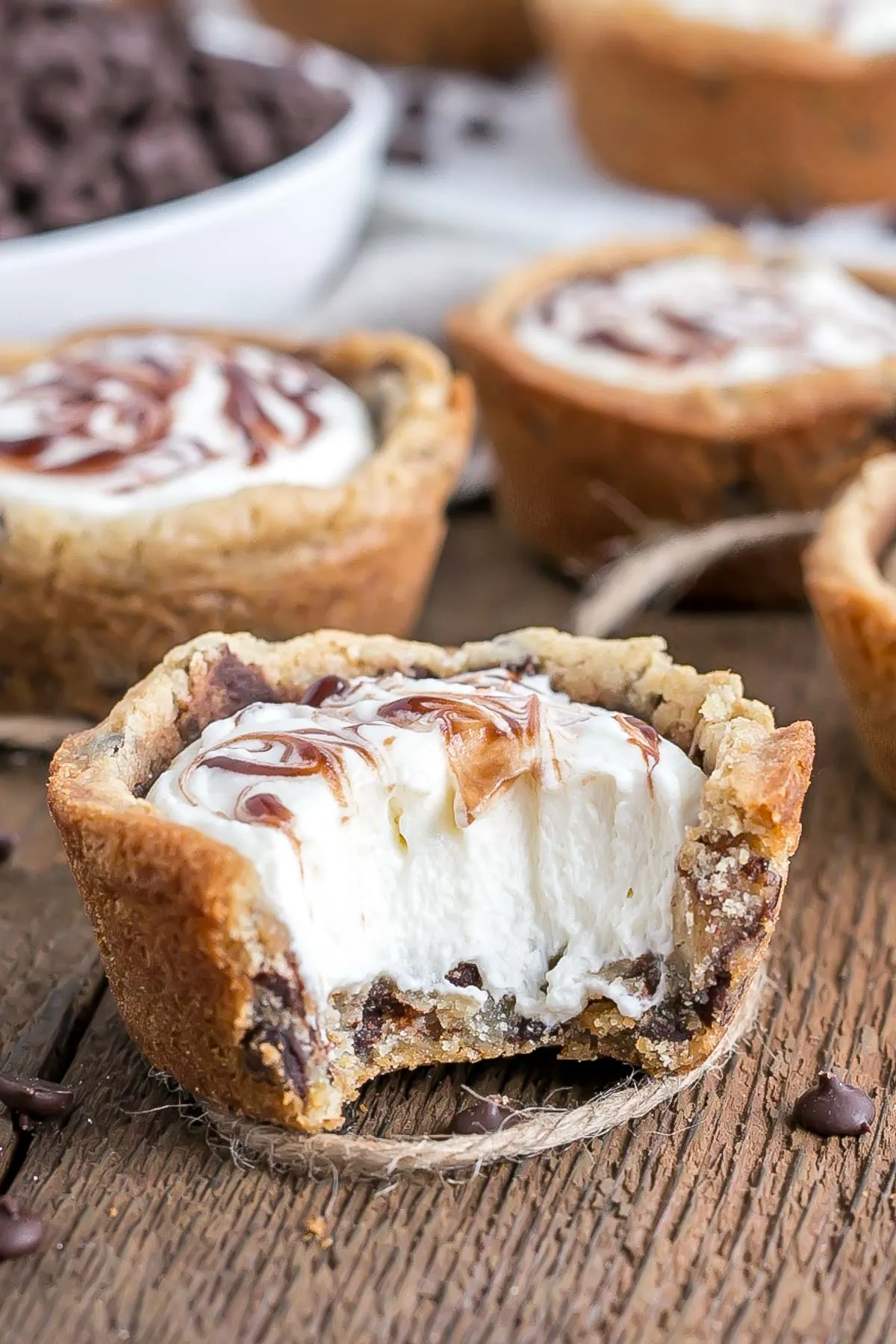 Close up of a cookie cup with a bite taken out.