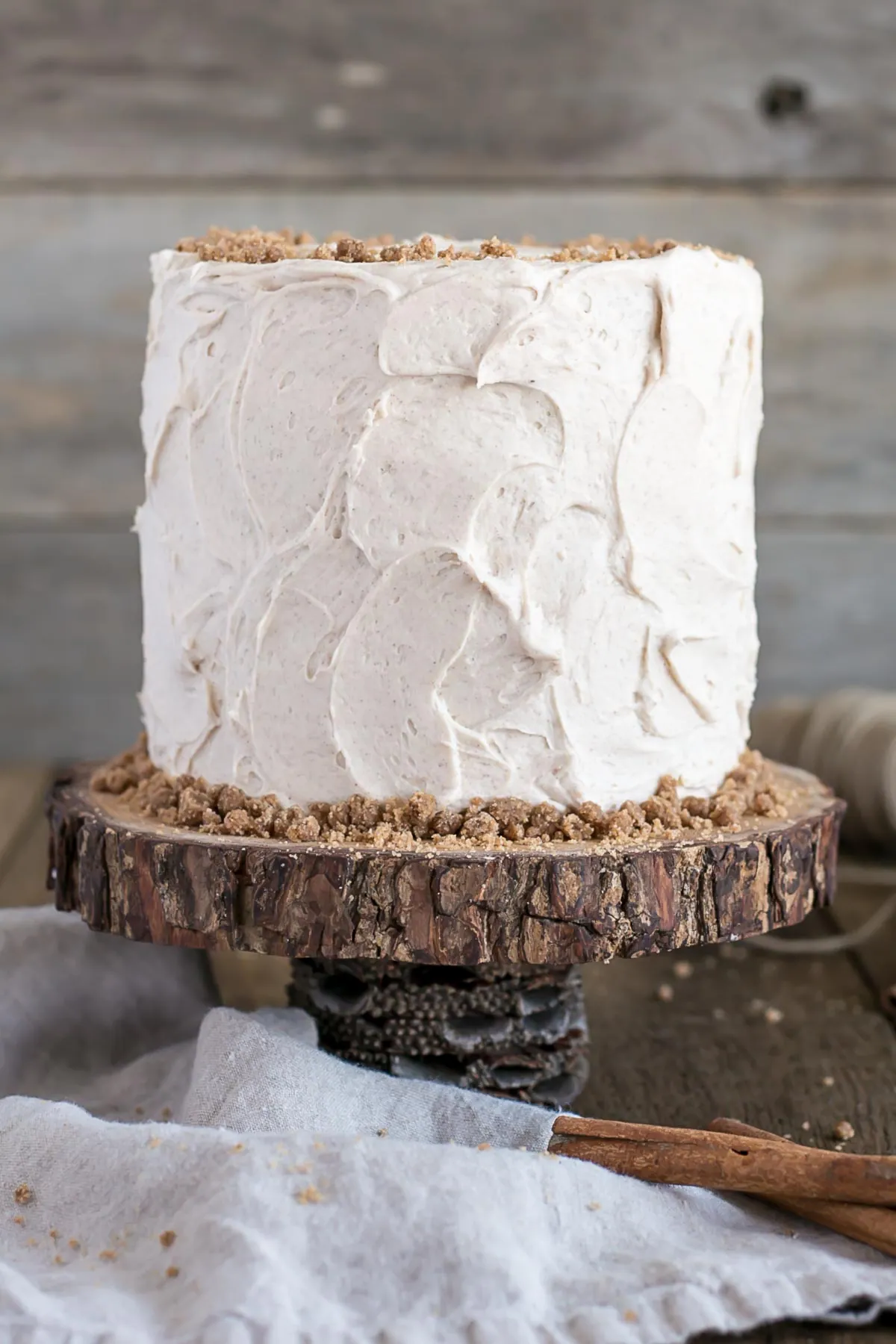 Spice Cake on top of a rustic wooden cake stand.