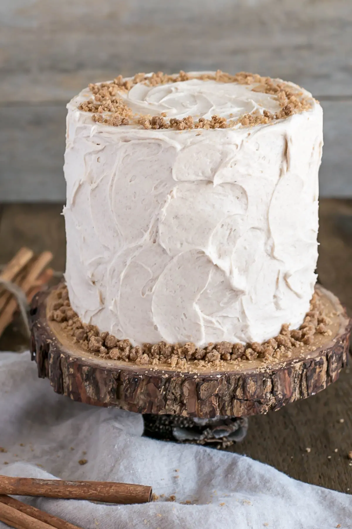 Spice Cake on top of a rustic wooden cake stand.