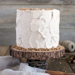 Spice Cake on top of a rustic wooden cake stand.