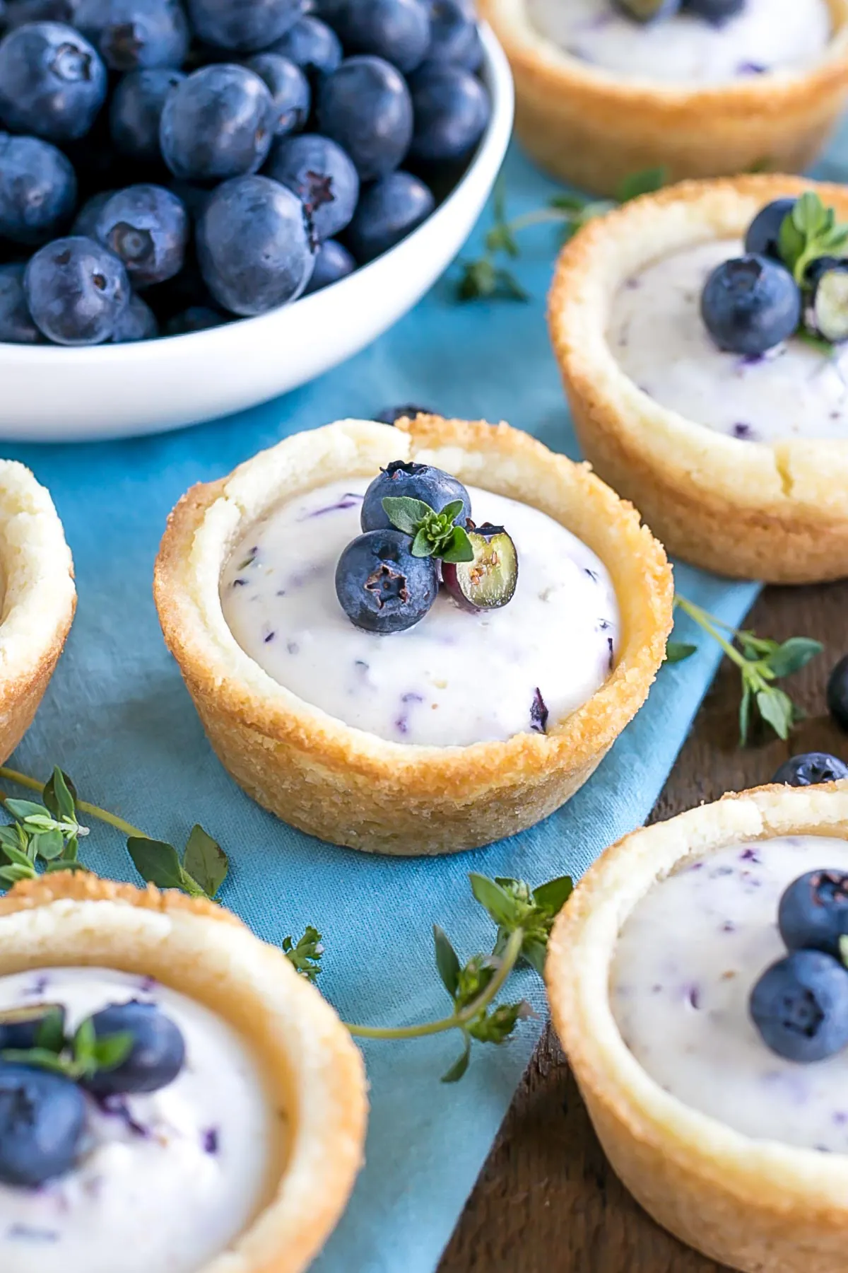 Close up of a cookie cup with blueberries on top