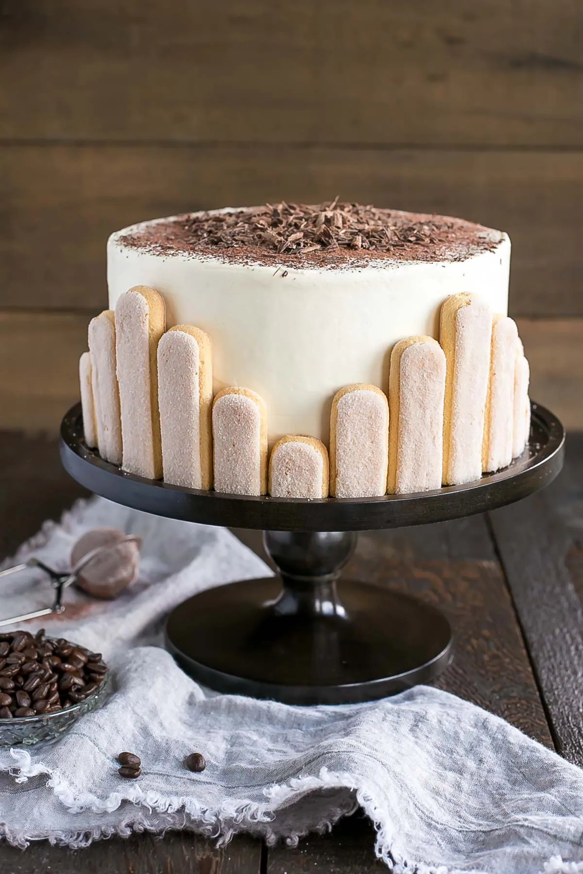 Angled shot of the cake on a dark cake stand.