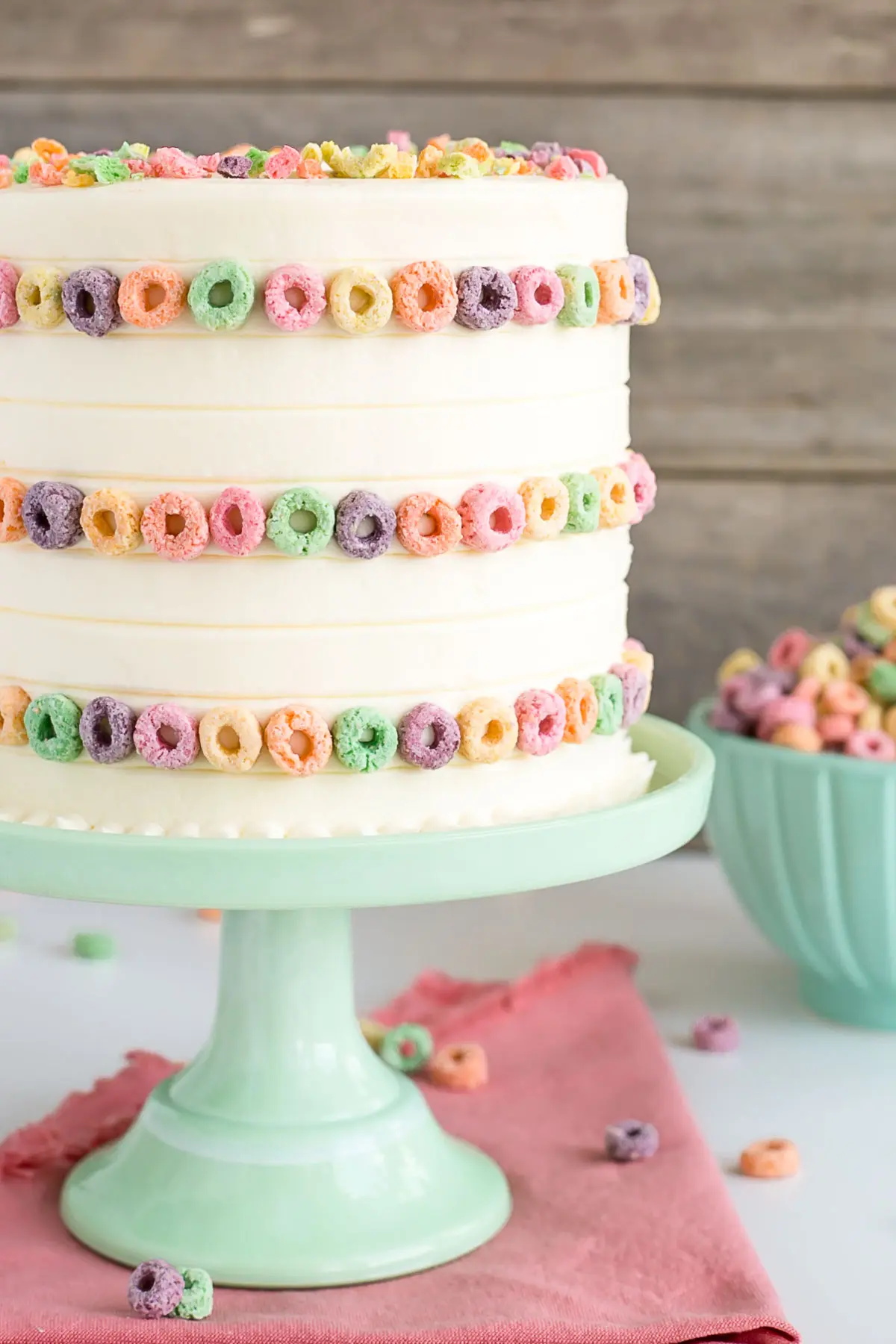 Close up of the side of the cake on a green cake stand.