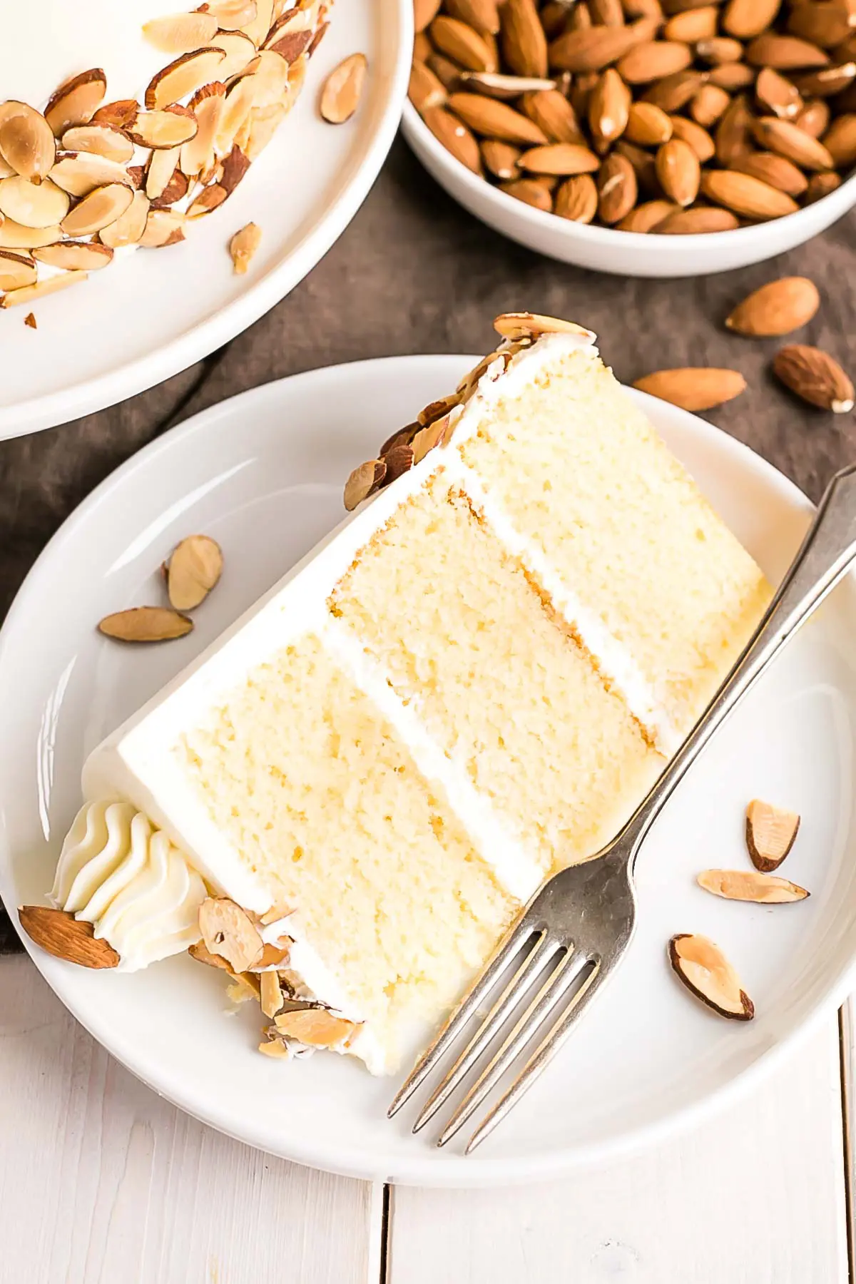 Cut slice of Almond Amaretto Cake.