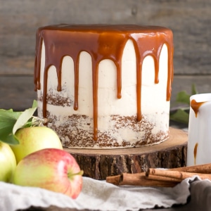 Kick off Apple season with this delicious Caramel Apple Cake! A spice cake made with diced apples, paired with a caramel buttercream, and caramel drizzle. | livforcake.com