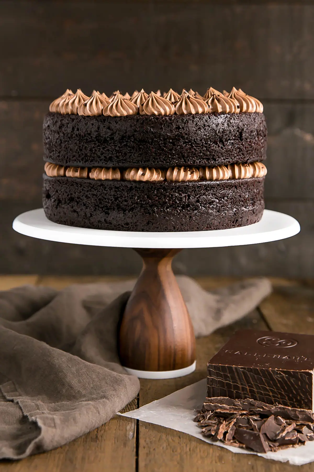 A chocolate cake sitting on top of a wooden table