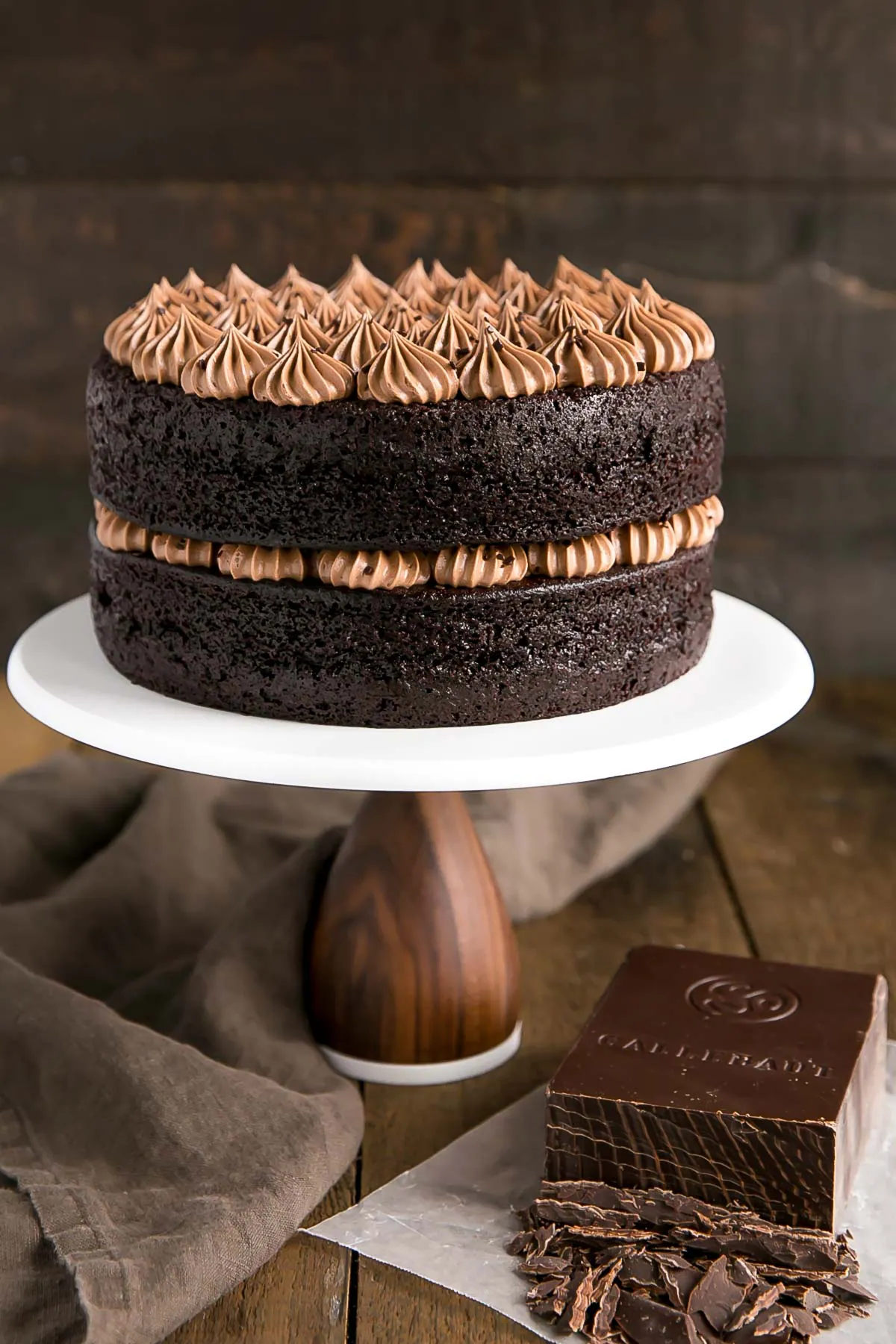 A large chocolate cake sitting on top of a table