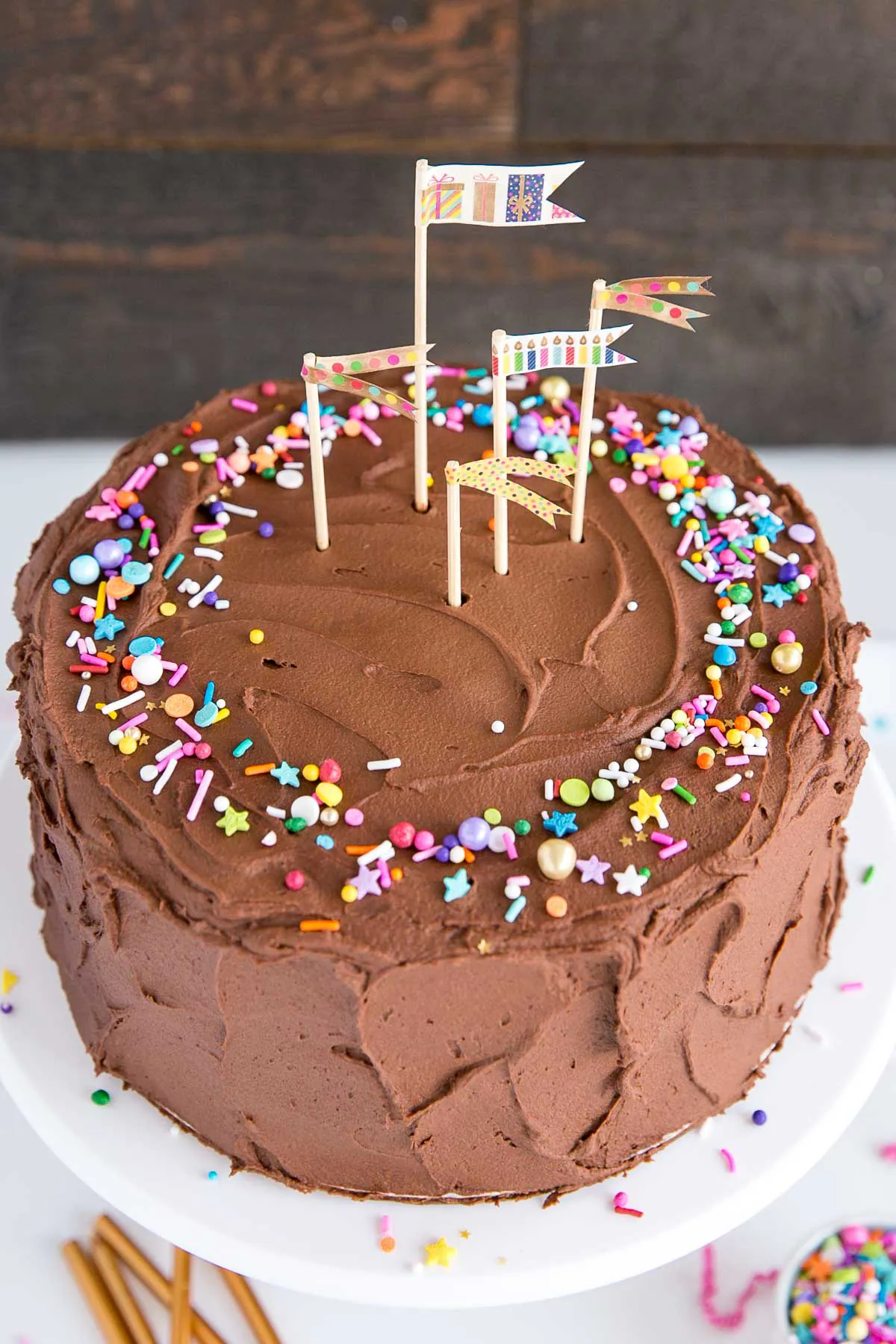 Birthday cake with flags and sprinkles