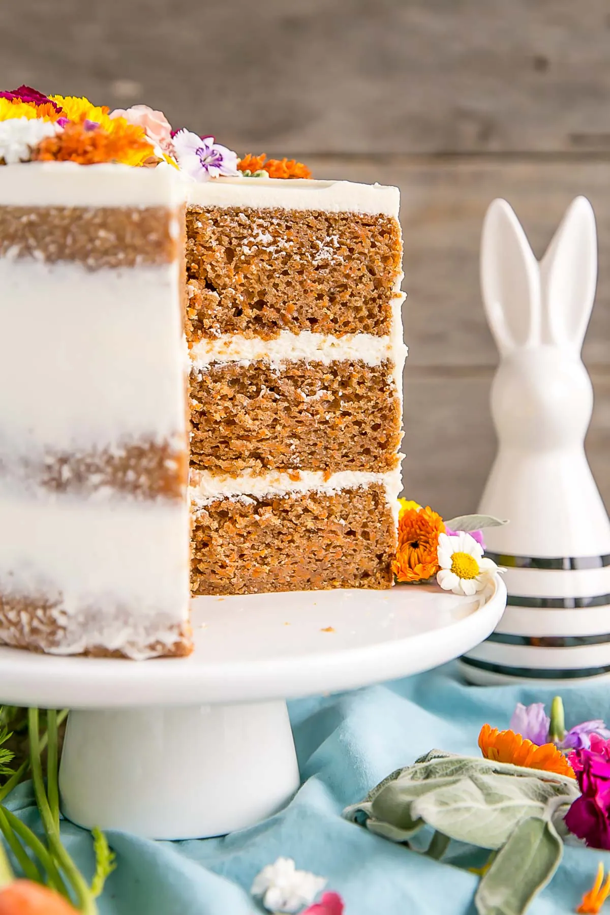 Naked carrot cake with edible flowers
