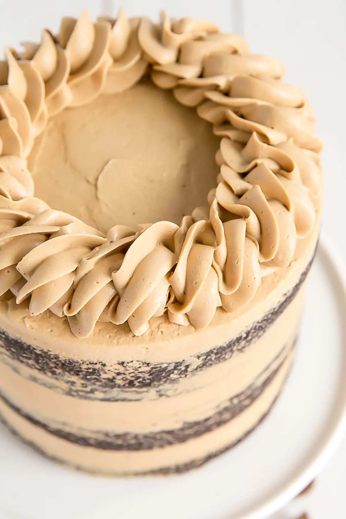 Chocolate Cake with peanut butter frosting. Decorative rope border on top.