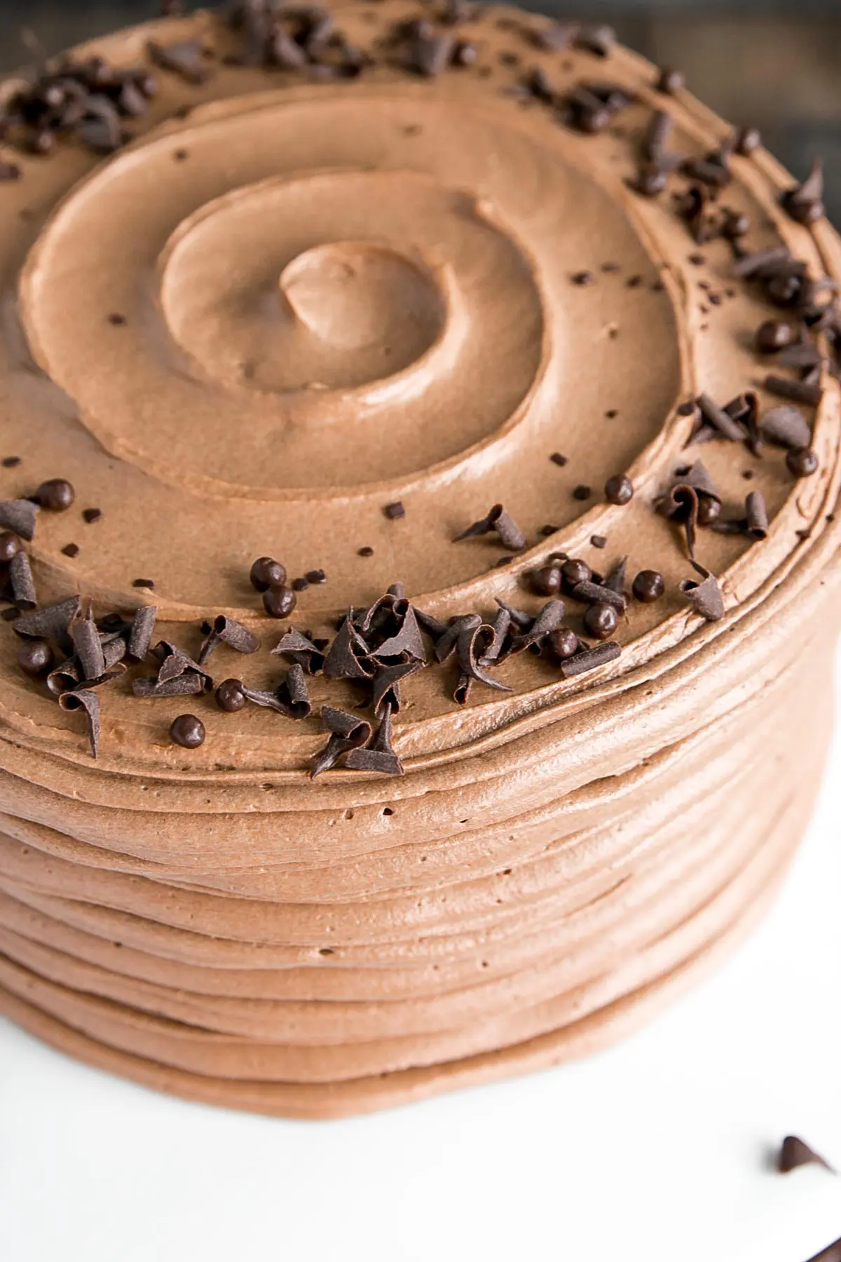 Close up of chocolate curls on the top of the cake.
