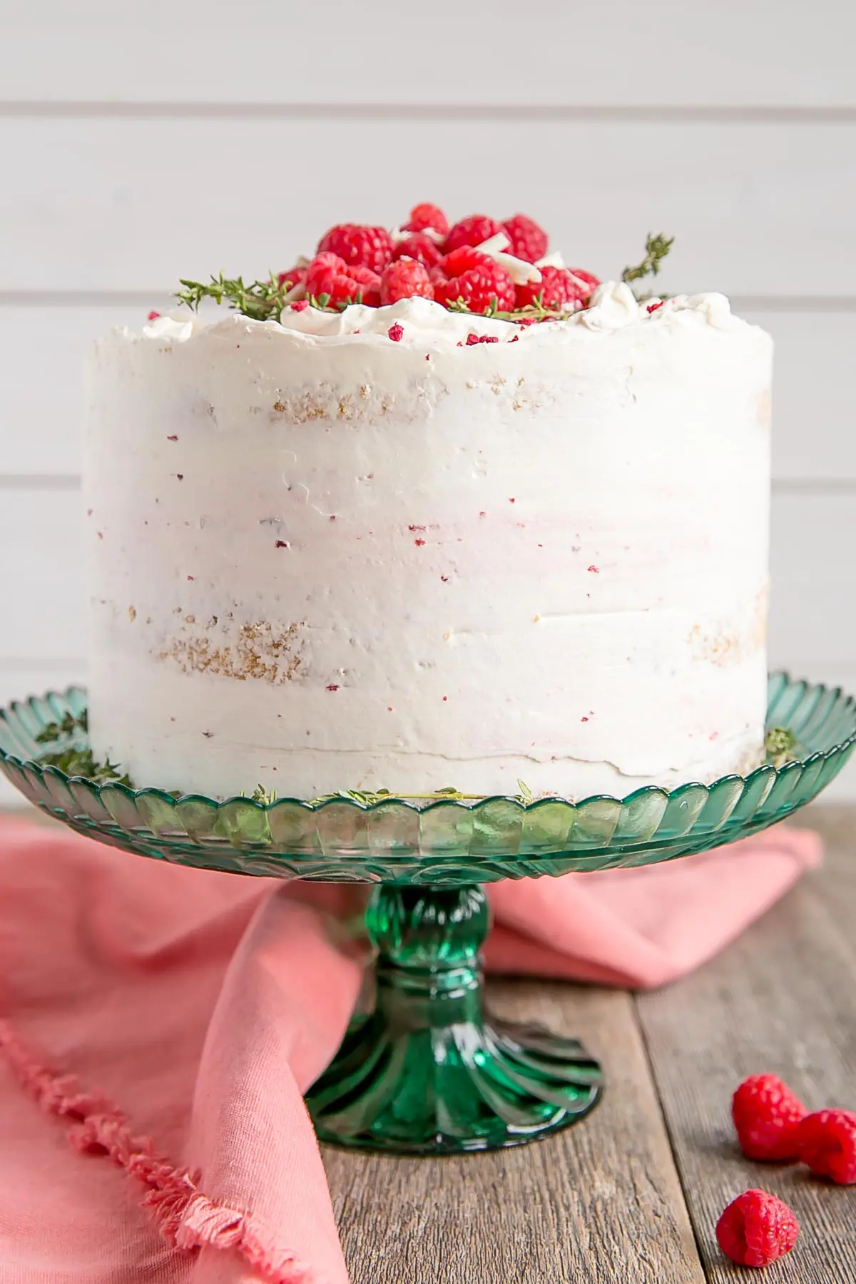 White chocolate cake with fresh raspberries and raspberry jam.