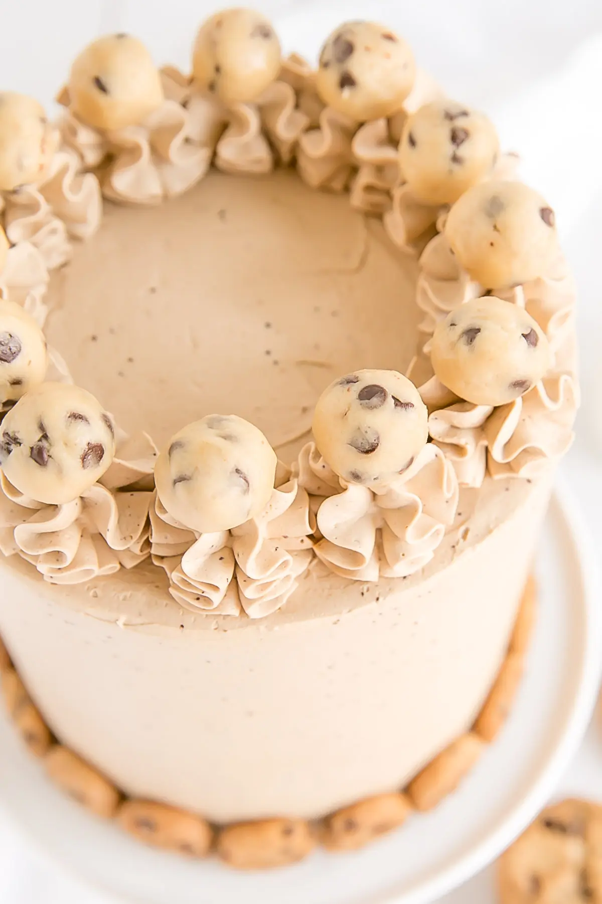 Edible cookie dough balls on a Chocolate Chip Cookie Cake