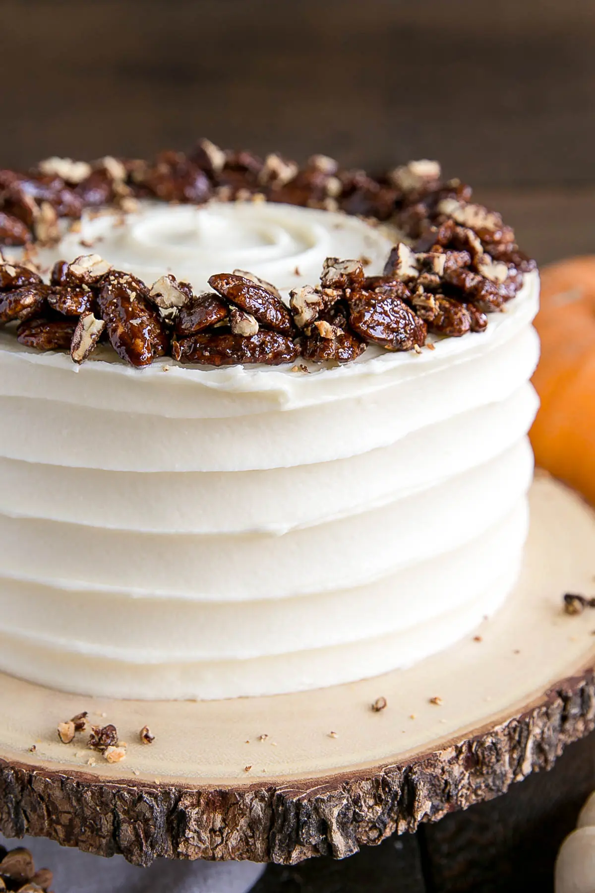 Close up of the cake with a rustic cream cheese frosting.