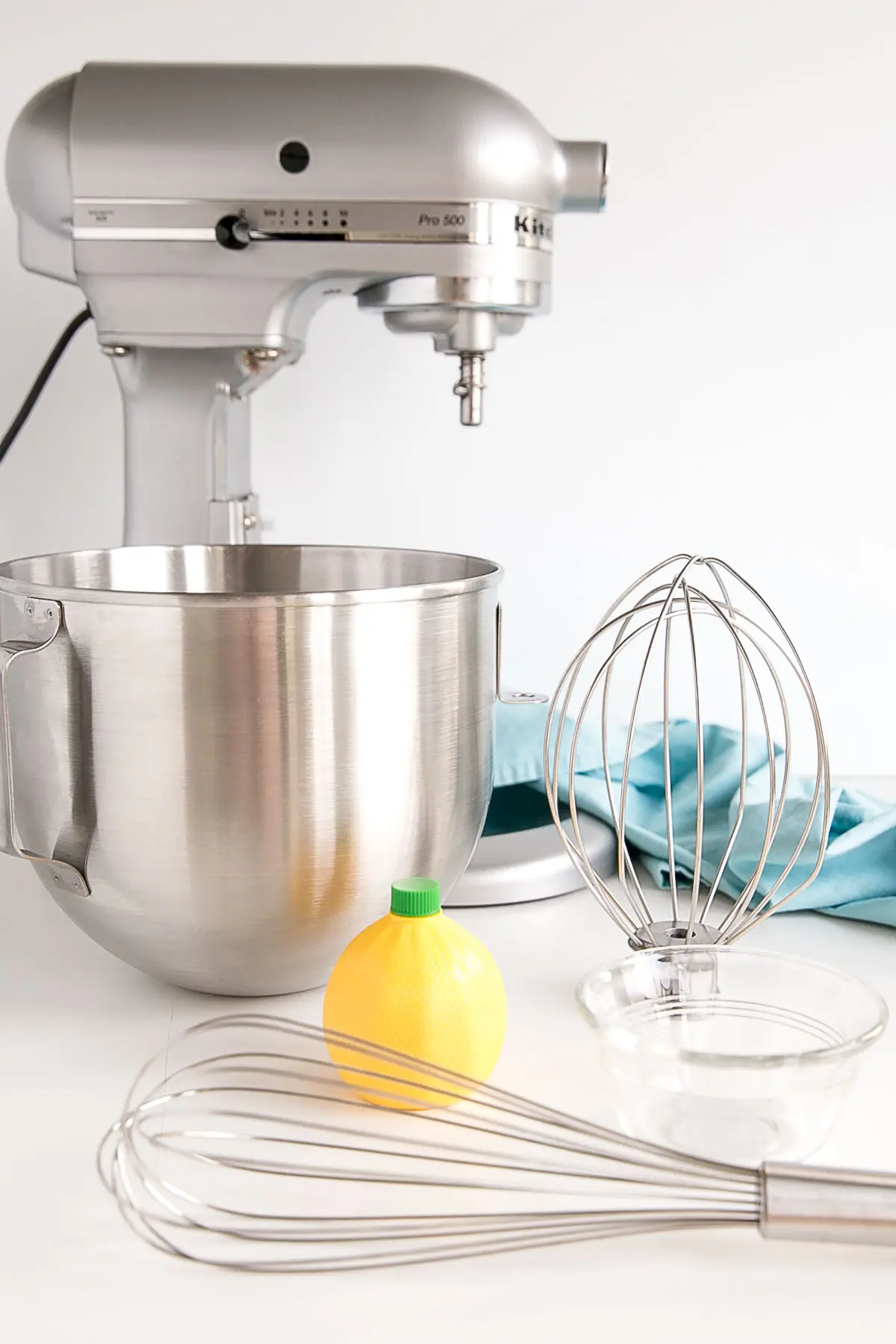 Tools to make Swiss Meringue buttercream shown with lemon juice